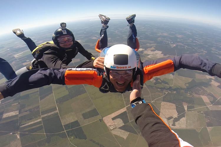 Student in freefall with two instructors during Airboss AFF course